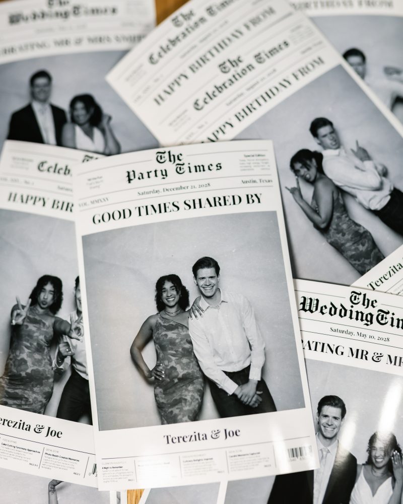 Stack of personalized newspaper-style party invitations featuring photos of a smiling couple.